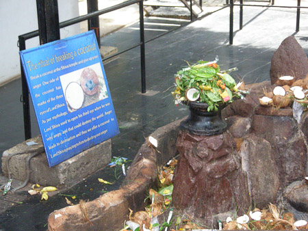 Breaking a coconut at Shiva Temple